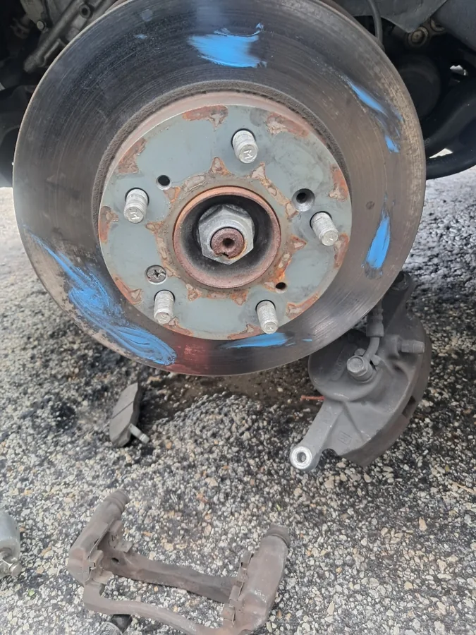 Brake rotor and hub up close during a brake job by Fredoo Mobile Tire Shop in Fort Lauderdale, FL